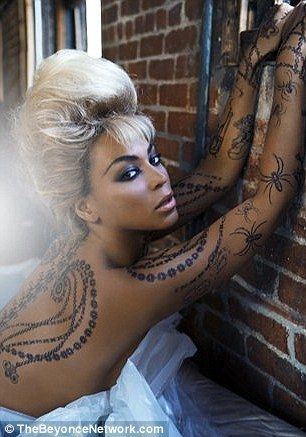 Beyonce sexy si super tatuata pentru lansarea noii linii vestimentare FOTO