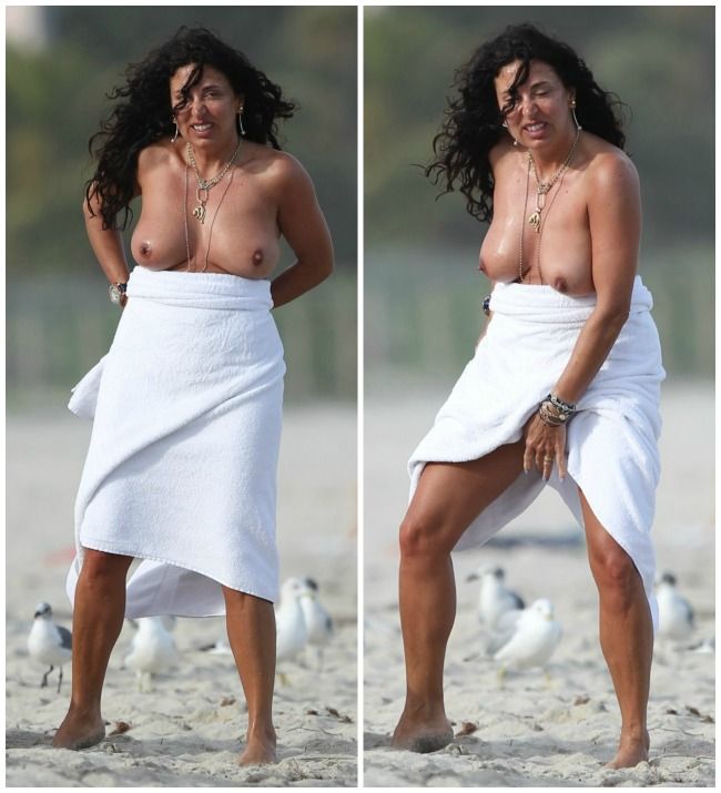 Show incendiar pe o plaja din Miami. Prietena unui cunoscut model international a renuntat complet la sutien si facut niste gesturi de-a dreptul dezgustatoare
